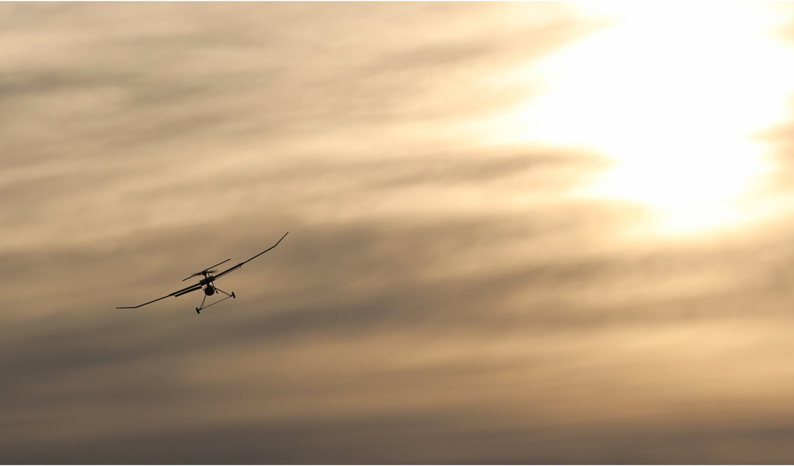 The VAST UAV in flight at sunset